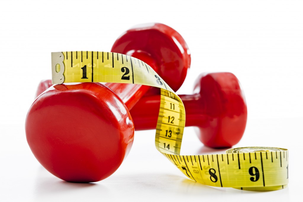 Red weights with measuring tape