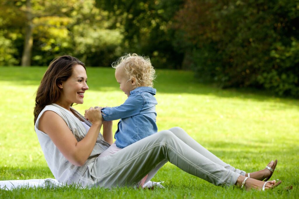 mother and child outside in a field
