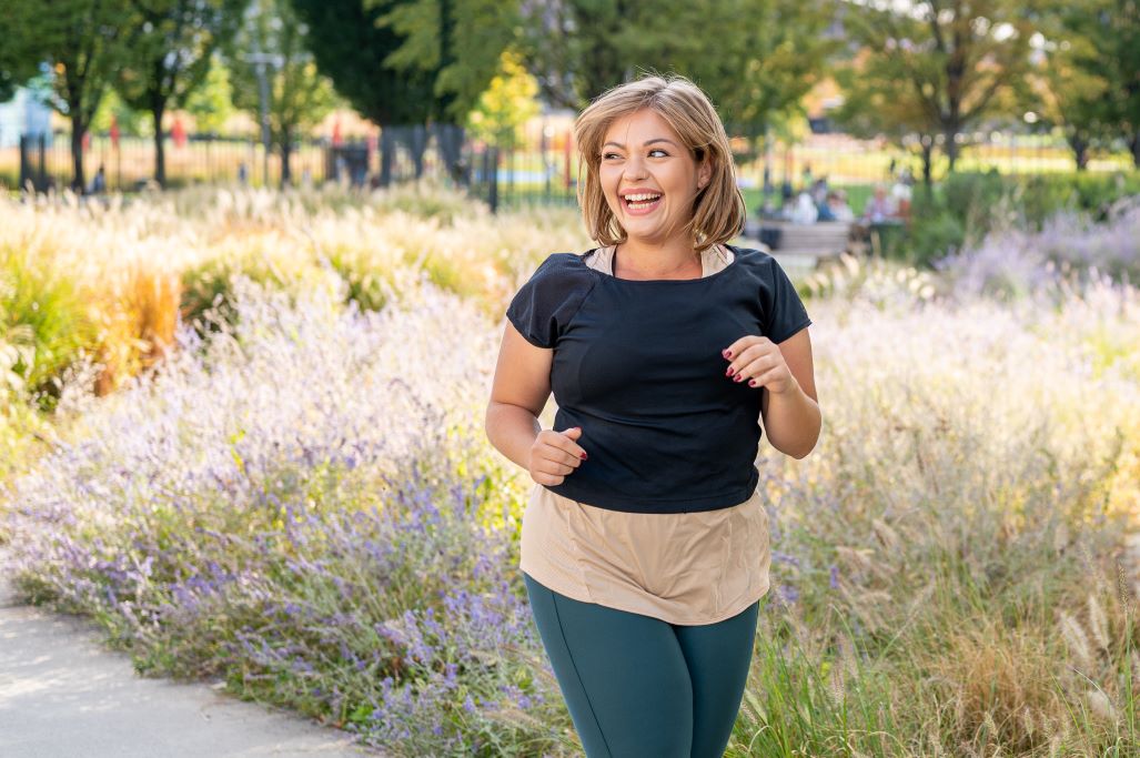 happy woman outside jogging